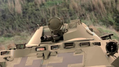 Close Up of Armored Personnel Carrier and Machine Gun Barrel