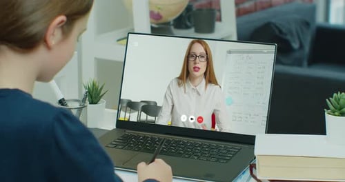 Little School Age Child Girl Talk By Videocall Laptop Screen View Over Woman Shoulder Sitting at