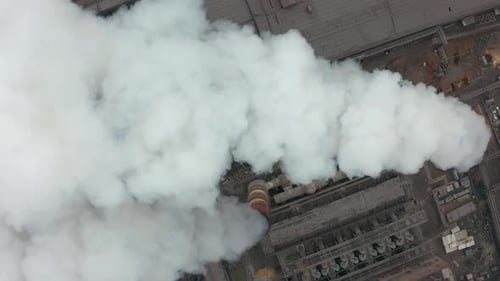 Industrial Zone with a Large Pipe Thick White Smoke Is Poured From the Factory Pipe