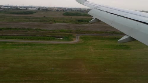 Airplane Flying Over Field Landing