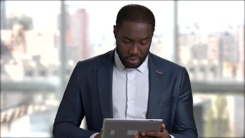 Professional Man in Suit Using Tablet, Talking