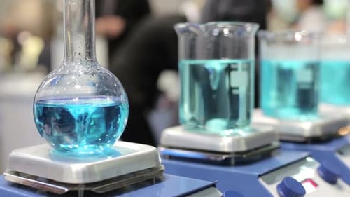 Close up of Blue Liquid Stirring in Lab Equipment