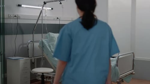 Woman Relaxing in Hospital Bed Getting Treatment
