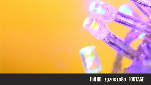 Flashing LED Lights Against a Gold Background
