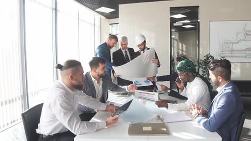 Architects and Engineers Collaborate in Modern Office