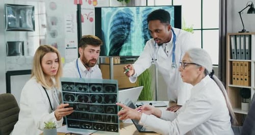 Doctors Discussing X-Ray in a Hospital Setting