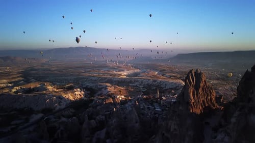 Aerial Scenery of Plenty Flying Hot Air Balloons Over Mountains and Ancient City Cappadocia