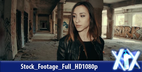 Woman Walks in Abandoned Building with Graffiti
