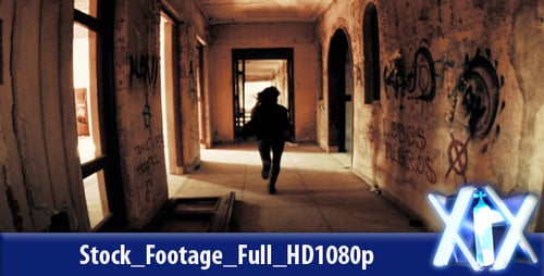 Woman Running in Derelict Graffiti Covered Building