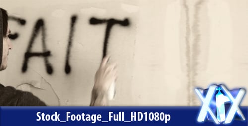 Young Adult Writes 'Faith' on Wall with Spray Paint