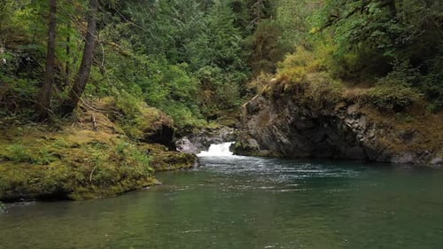 Water flowing in the creek and beautiful rock formation in the wilderness.
