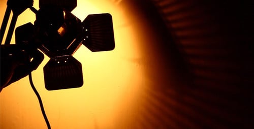 Studio Light Being Adjusted in Darkness