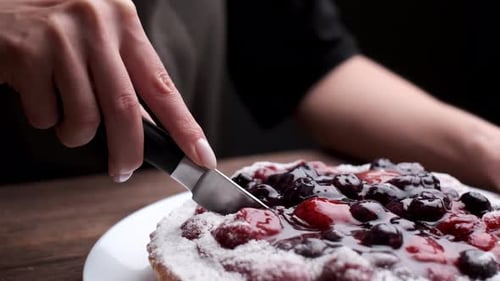 Cutting Berry Tart on Plate Close Up