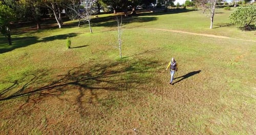 Man walking in park during autumn
