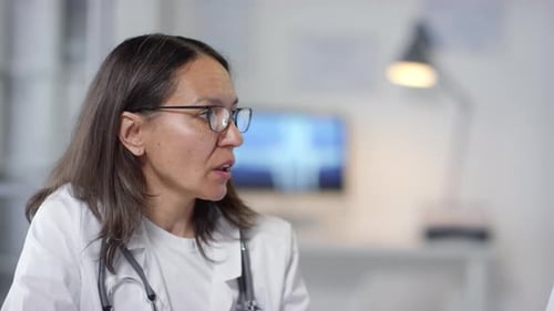 Two Doctors Discussing Healthcare in Medical Office