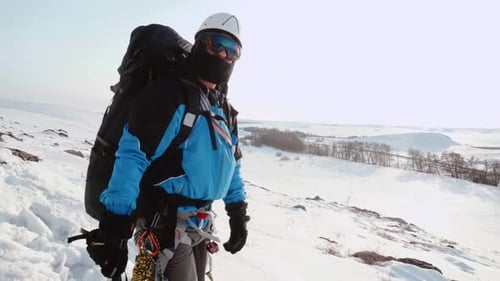 An Experienced Climber Stopped To Explore the Area and Shows Your Team Where They Need To Go Further