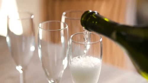 Champagne Pouring into Flute Glass for Celebration