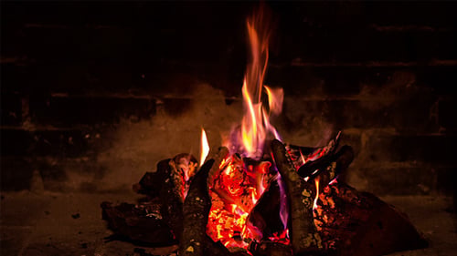 Glowing Fireplace Embers and Flickering Flames