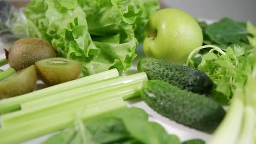 Lots of Green Vegetables and Fruits Isolated on White Background