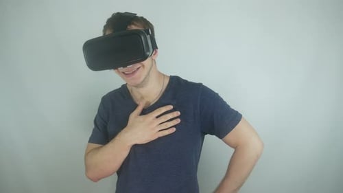 Young Man Enjoys Virtual Reality Headset Experience