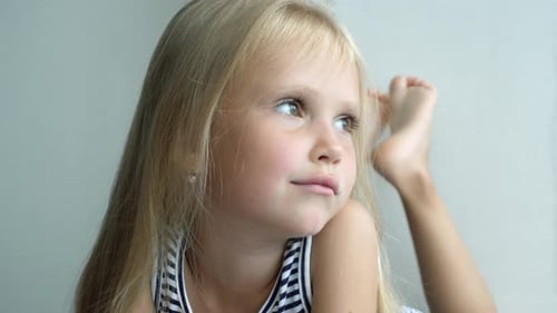 Girl Lying Down Looking off Into the Distance