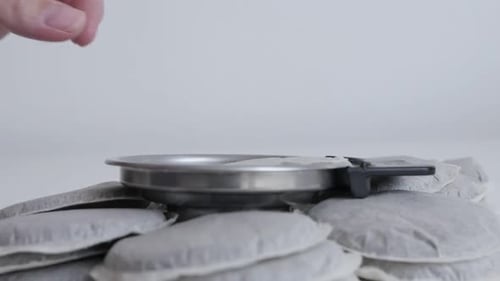 Close-up of Coffee Pod Insertion Into Filter