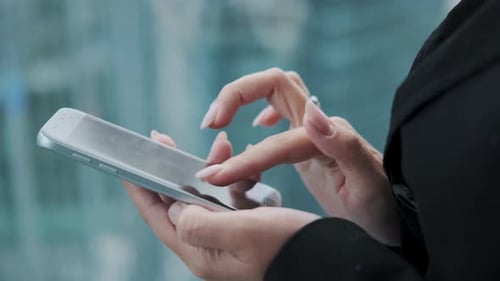 Smartphone in the Hands of a Woman. Girl Uses a Mobile Phone