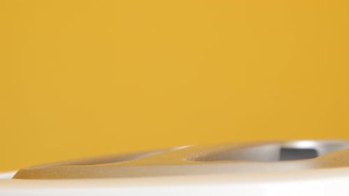 Toaster with Bread on Yellow Background, Close Up