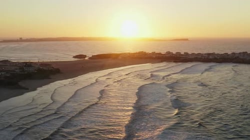 Aerial Footage of the Coastal Town During a Golden Hour