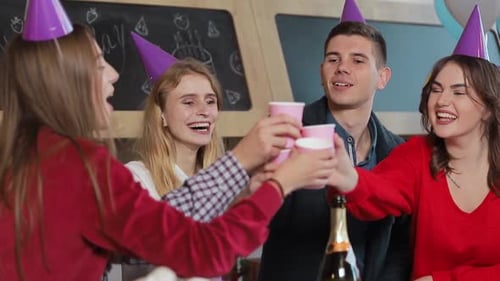 Young Friends Celebrate Birthday with Drinks and Gifts