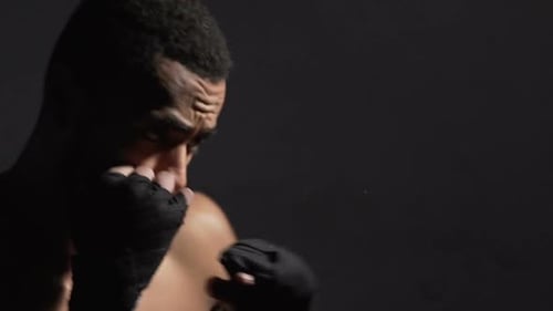 Strong Biracial Kickboxer Doing Air Punching Training, Muay Thai Combat Sport