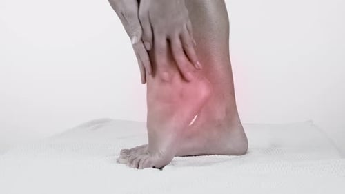 Massaging Injured Ankle and Foot
