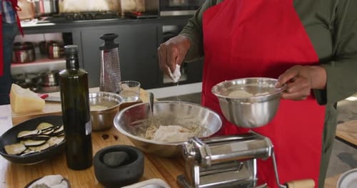 Chef adding more flour