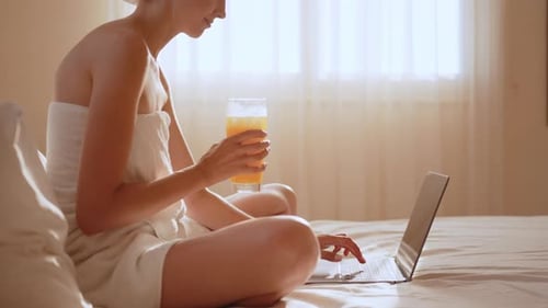 Young Woman Having Breakfast in a Modern Hotel Apartment
