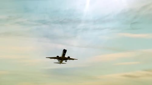 Airplane flying on a Cloudy Day.