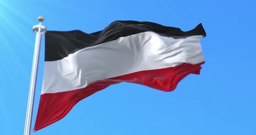 Black White Red Flag Waving in Blue Sky