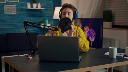 Woman Recording Podcast at Home on Laptop