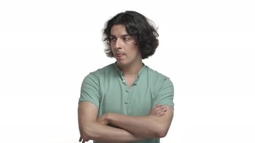 Man Looks Skeptical with Arms Crossed
