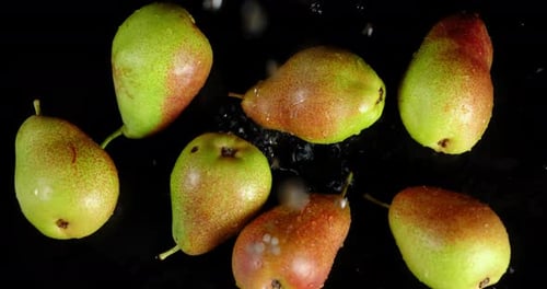 Pears Being Washed on a Black Surface