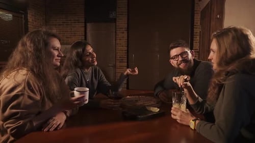 Interesting Friends Chatting with Each Other While Drinking Drinks in a Cafe
