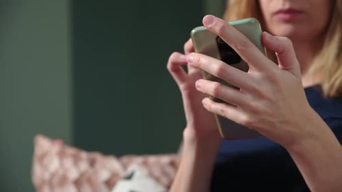 Woman Using Smart Phone Close Up Inside
