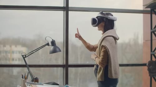 Woman Experiencing Virtual Reality in Modern Office