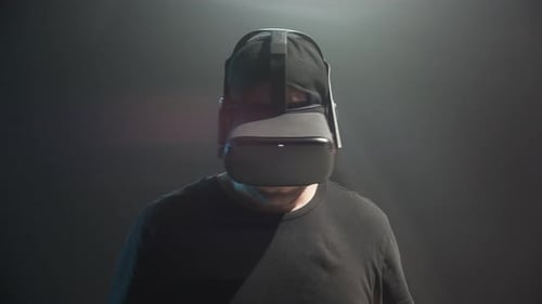Man Experiences Virtual Reality in Dark Studio
