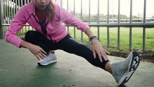 Sport girl sportswear doing yoga fitness exercise in street doing training workout in morning.