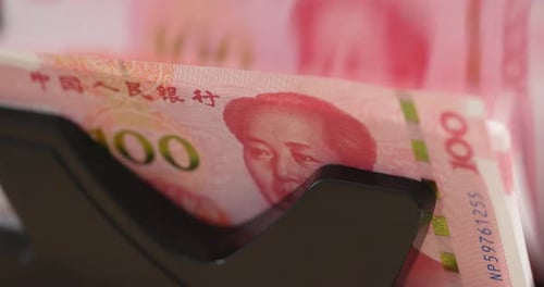 Renminbi being sorted in money counting machine