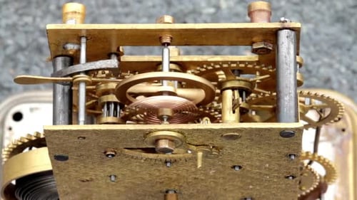 Clock Gears Turning in Close-Up