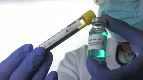 COVID-19 Sample and Vaccine Vial Close Up