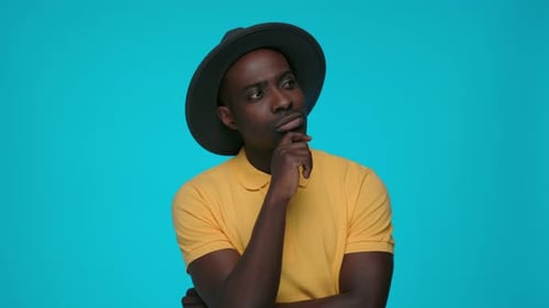 Thoughtful Young Man Posing in Studio Setting