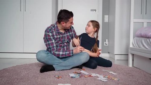 Father and Daughter Enjoying Playtime Together Indoors