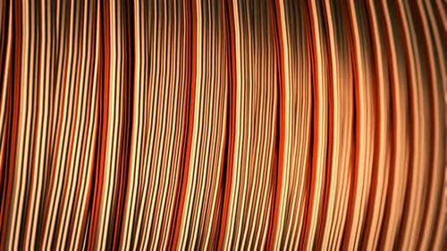 Close up of pure copper wire on the spool. Used in the electrical industry.
